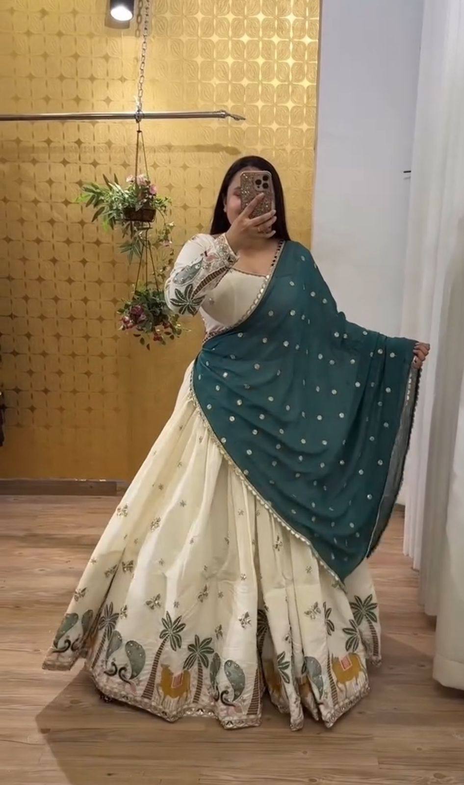 Lvory Lehenga With Animal Heavy Embroidery Thread & Sequence Work Border And Teal Dupatta Elegance.