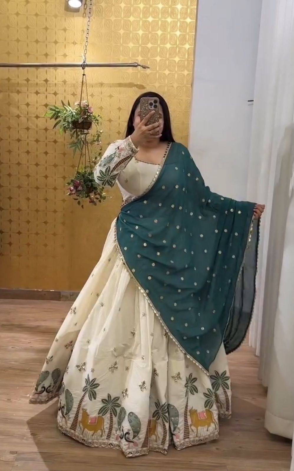 Lvory Lehenga With Animal Heavy Embroidery Thread & Sequence Work Border And Teal Dupatta Elegance.