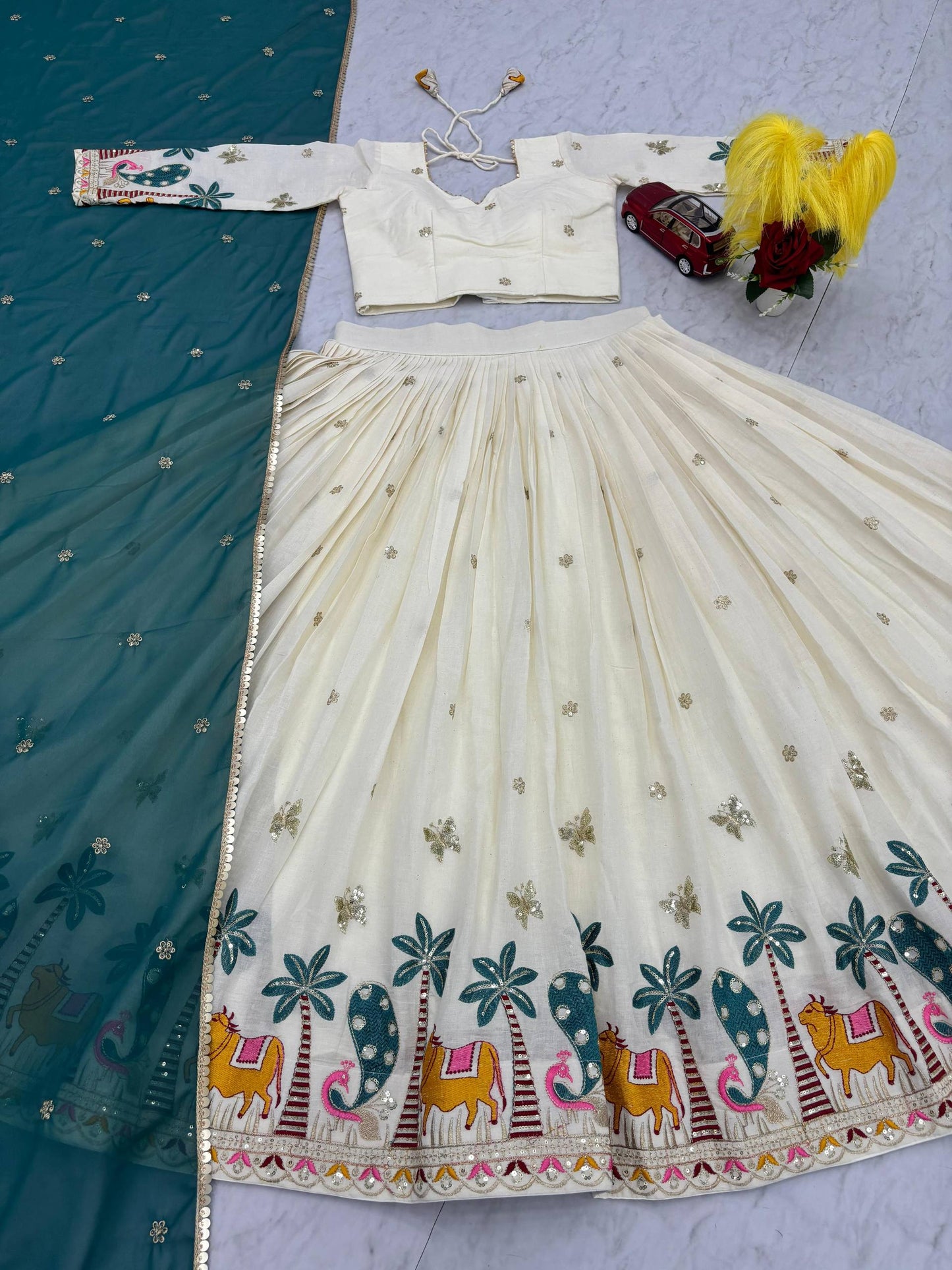 Lvory Lehenga With Animal Heavy Embroidery Thread & Sequence Work Border And Teal Dupatta Elegance.