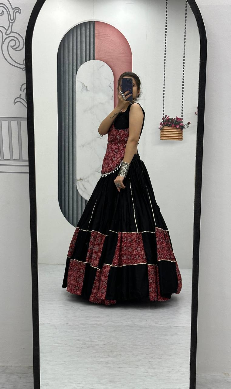 Black And Red Traditional Flared Lehenga With Printed Blouse.