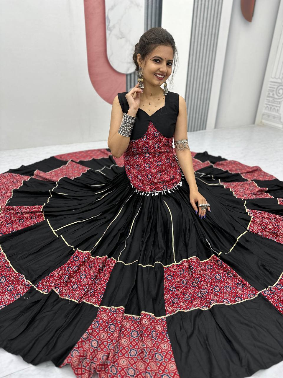 Black And Red Traditional Flared Lehenga With Printed Blouse.