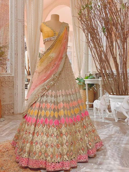 Multicolored Net Sequence Semi-Stitched Lehenga Choli.