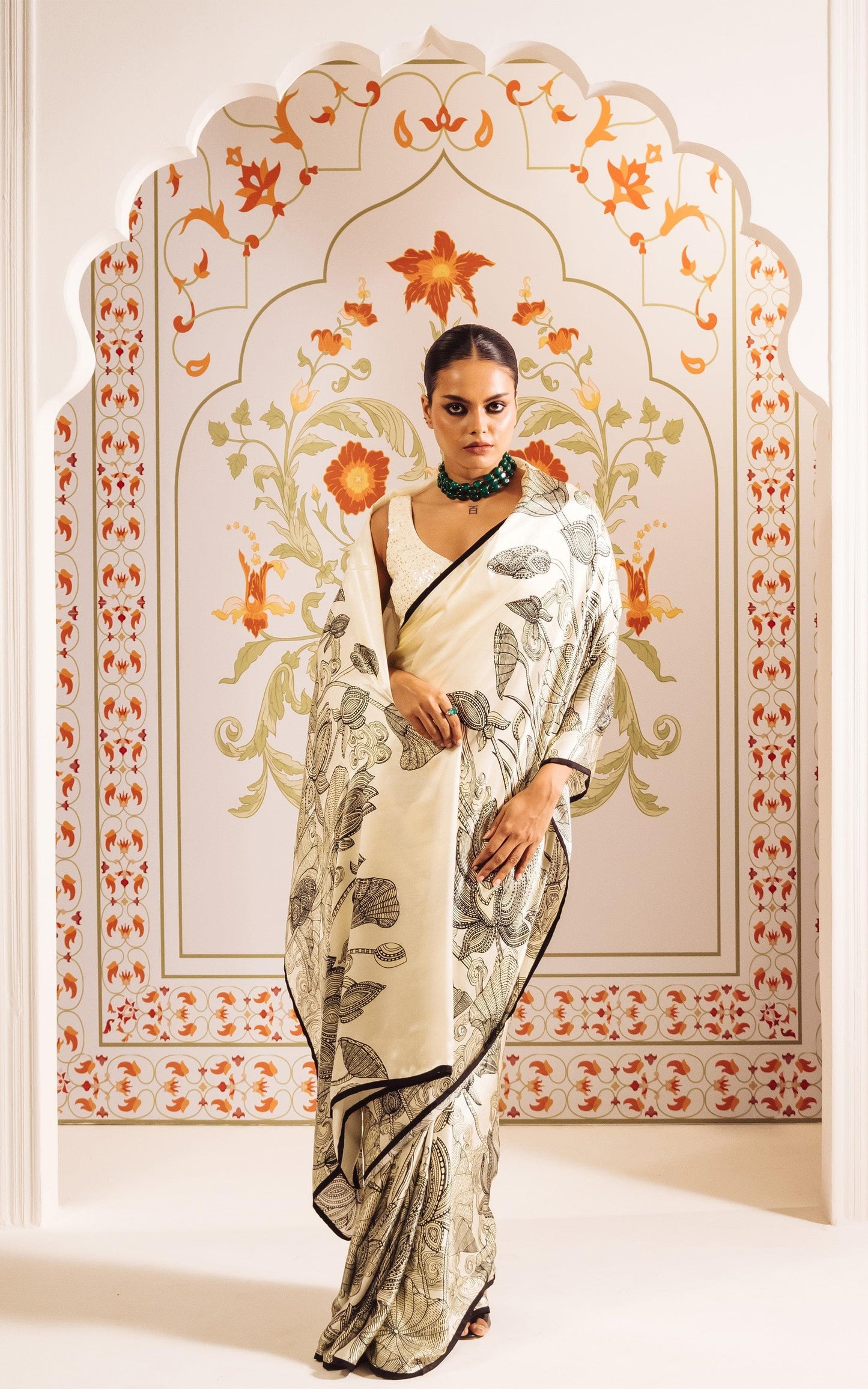 Elegant Ivory Saree with Black Floral Sketch Style Detailing