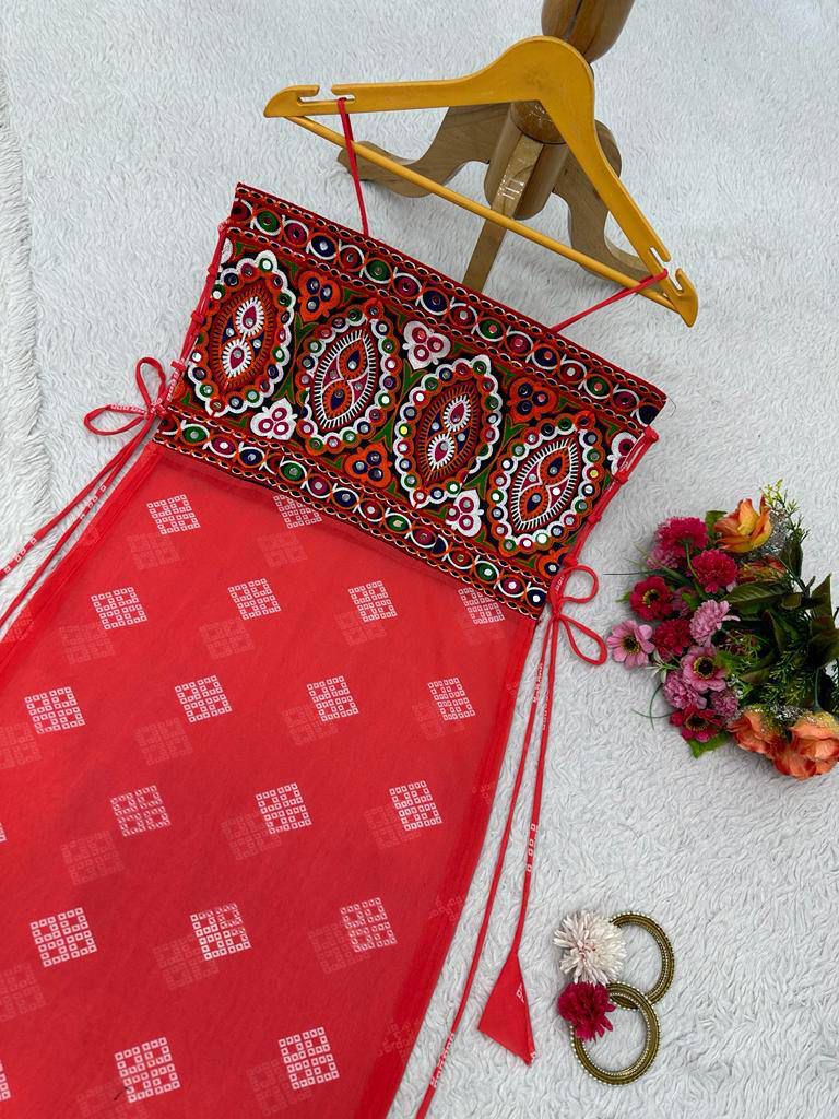 Red bandhani dress with mirror-work embroidered kutchi style blouse.