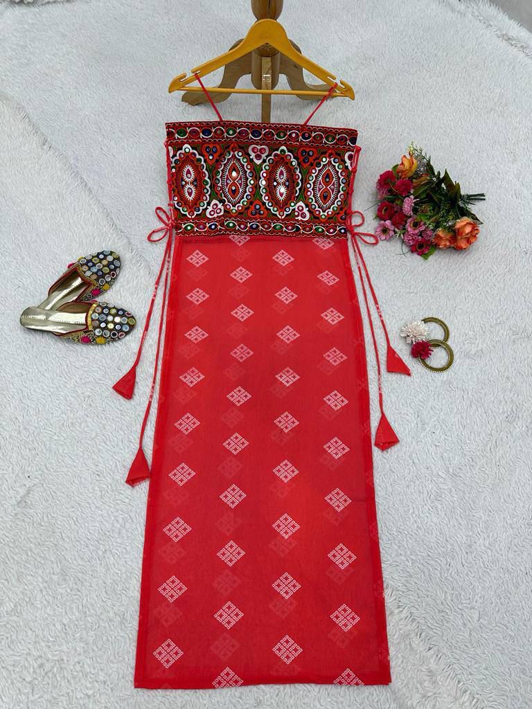 Red bandhani dress with mirror-work embroidered kutchi style blouse.