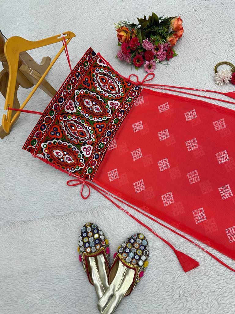 Red bandhani dress with mirror-work embroidered kutchi style blouse.