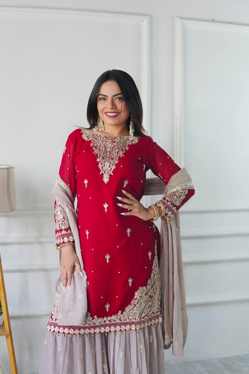 Maroon red embroidered kameez sharara with gold embroidery.