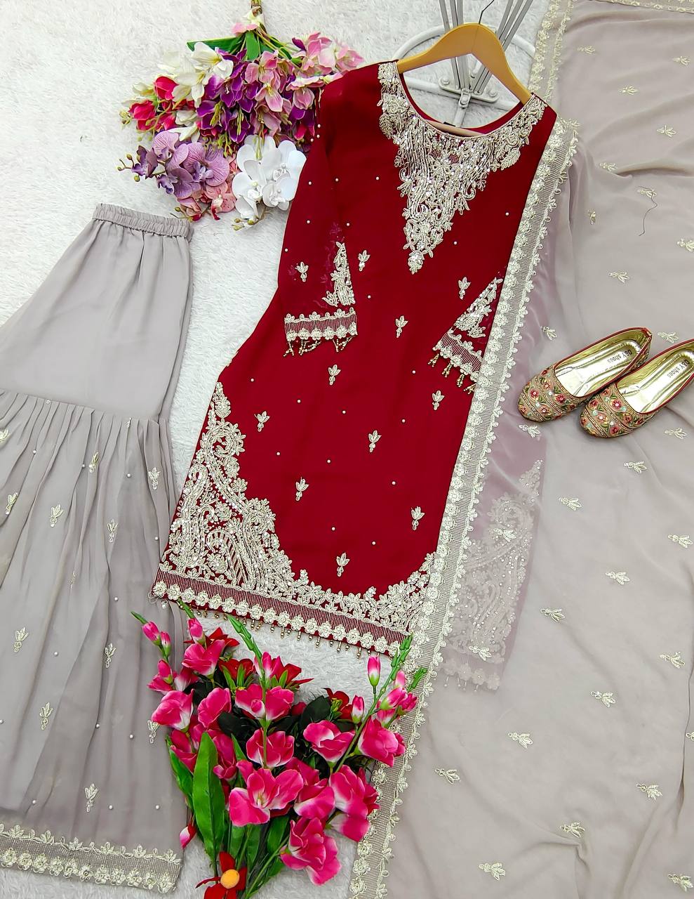 Maroon red embroidered kameez sharara with gold embroidery.