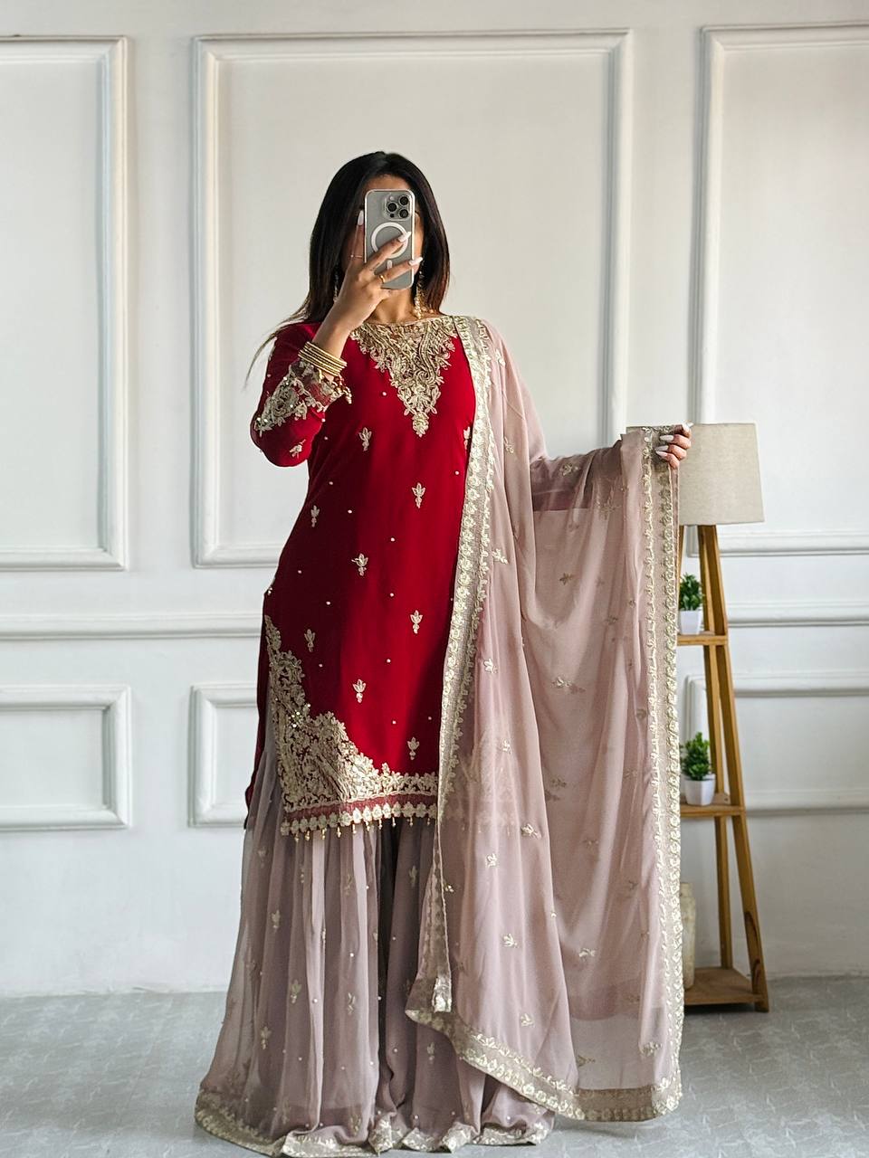 Maroon red embroidered kameez sharara with gold embroidery.