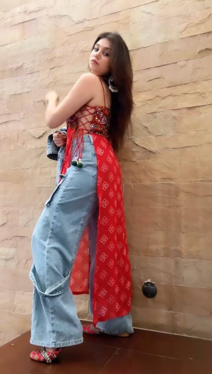 Red bandhani dress with mirror-work embroidered kutchi style blouse.