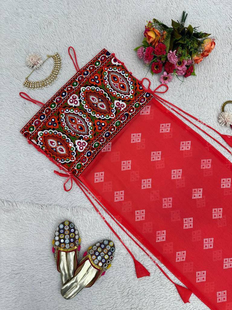 Red bandhani dress with mirror-work embroidered kutchi style blouse.