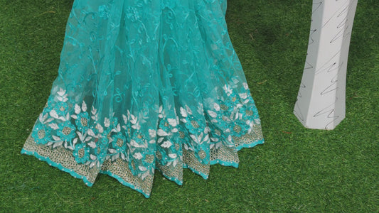 Imposing Sky Blue Colored Nylon Net With Heavy Embroidered Work Saree